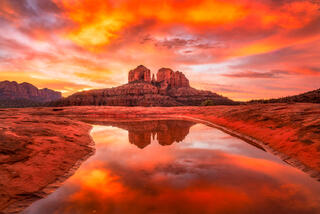 A reflection of Cathedral Rock in Sedona at sunrise